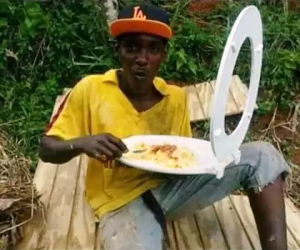 A Man Pictured Eating From A Toilet Seat